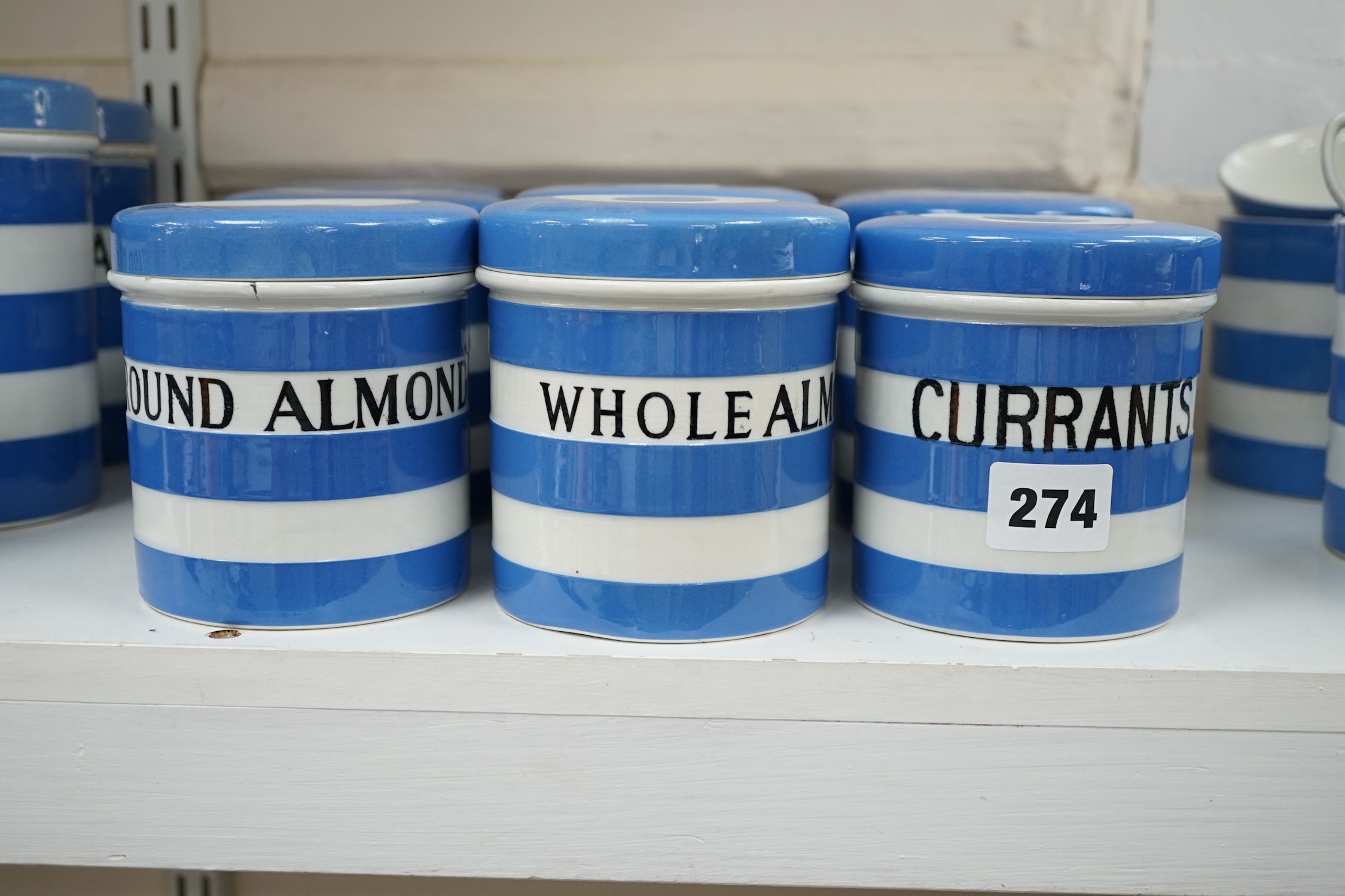 T.G.Green Cornish Kitchenware, nine 10.5cm lidded storage jars to include China Tea, Pearl Barley, Spice, Currants and Ground Almonds, mainly Black Shield marks. Condition - fair to good